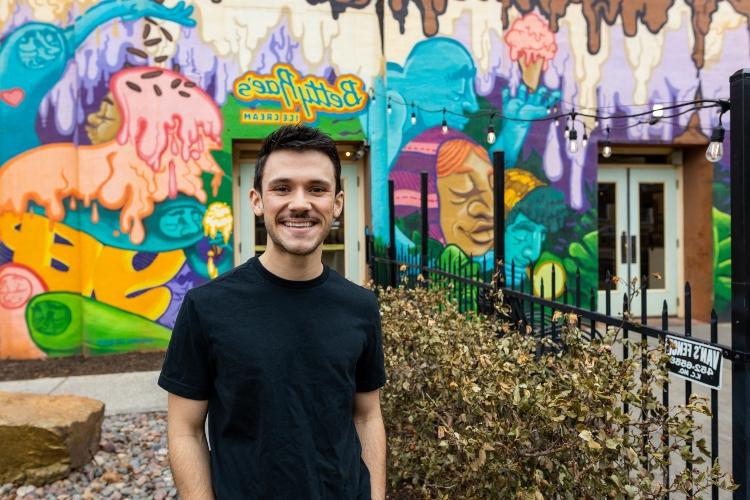 Alec Rodgers stands in front of Betty Rae's ice cream shop