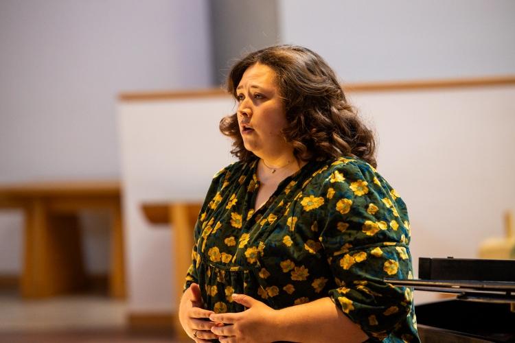 Roslinde Rivera sings during a performance rehearsal