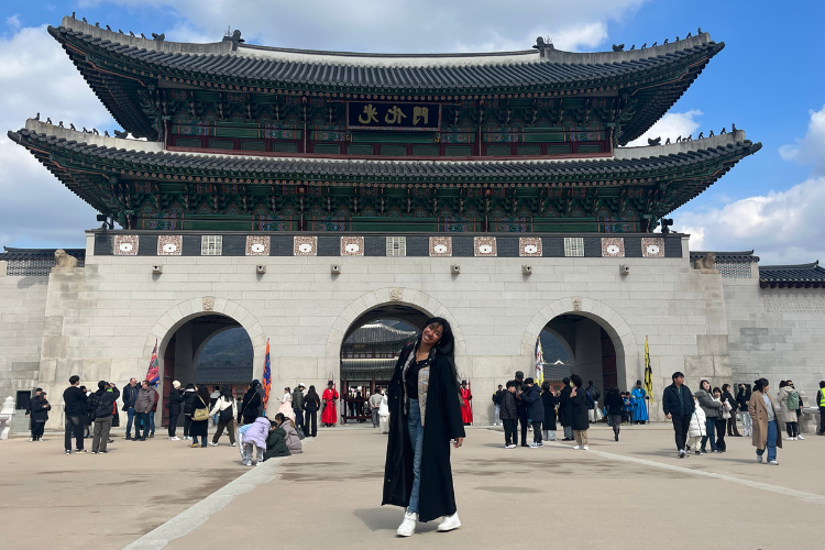 Liberty Gladden stands infront of a South Korea attraction.